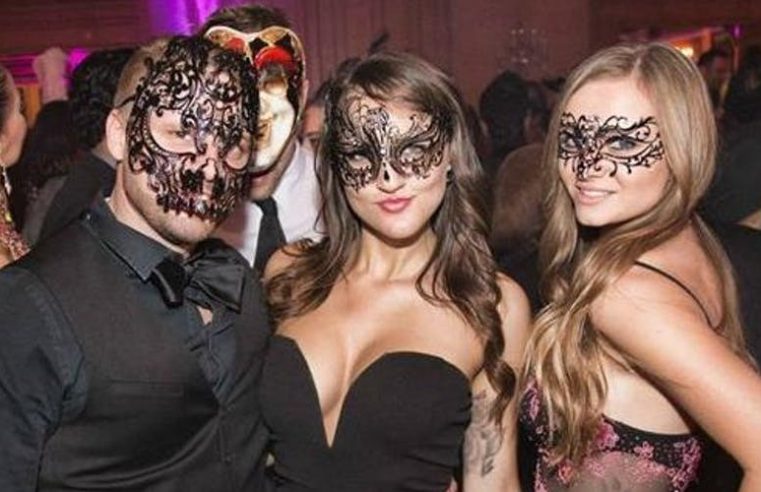 What is the concept of a masquerade ball?